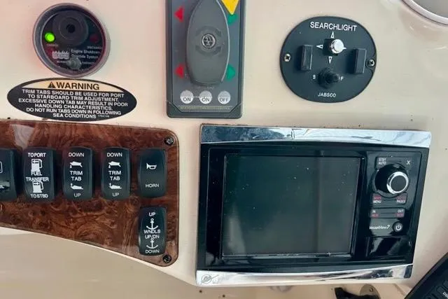 Slide: The Image of Control panel of a 2007 Meridian 368 Motoryacht with navigation and searchlight controls. - 12