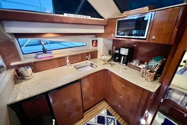 Slide: The Image of Luxurious kitchen area in a 2007 Meridian 368 Motoryacht with modern amenities. - 19