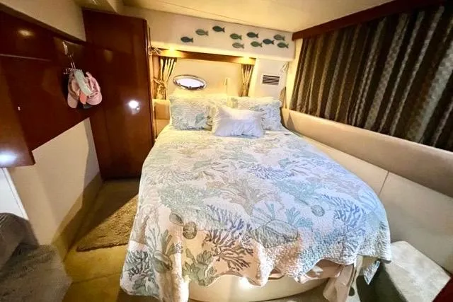 Slide: The Image of Luxurious bedroom interior of 2007 Meridian 368 Motoryacht with nautical decor. - 26