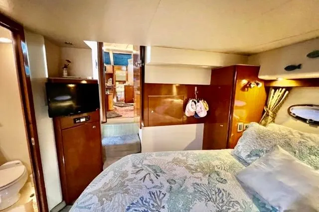 Slide: The Image of Luxurious 2007 Meridian 368 Motoryacht bedroom with elegant decor and modern amenities. - 28