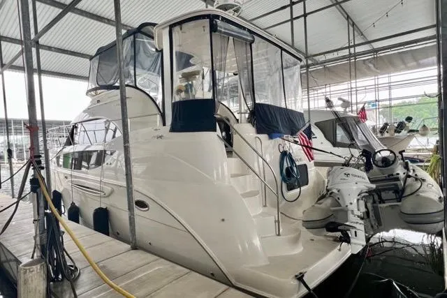 Slide: The Image of 2007 Meridian 368 Motoryacht docked in a covered marina, rear view. - 3
