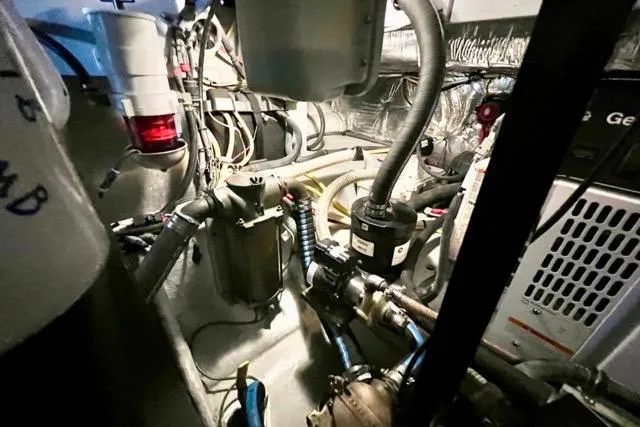 Slide: The Image of Engine room of 2007 Meridian 368 Motoryacht with visible machinery and wiring. - 34