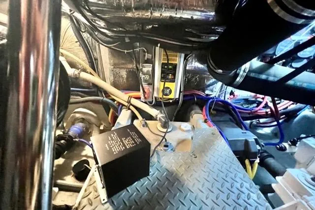 Slide: The Image of Engine room of a 2007 Meridian 368 Motoryacht with visible wiring and components. - 35