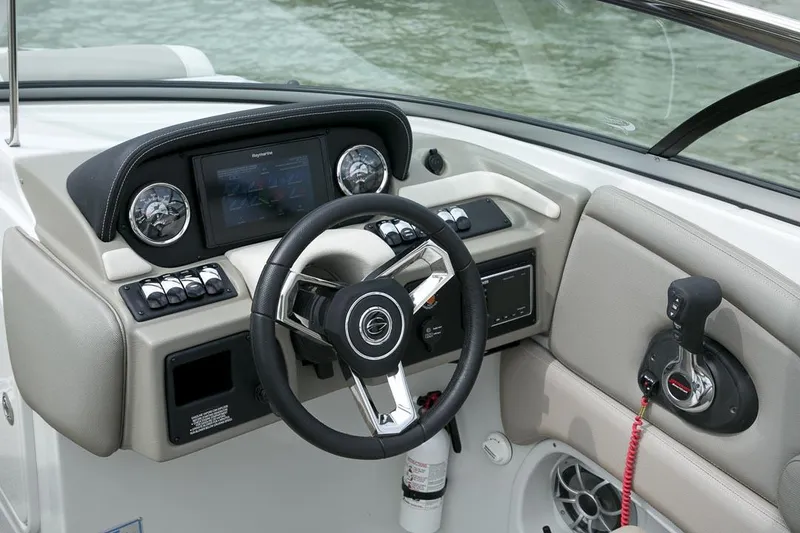 Slide: The Image of Manufacturer Provided Image: 2026 Crownline Eclipse E255 boat dashboard with steering wheel and control panel. - 8