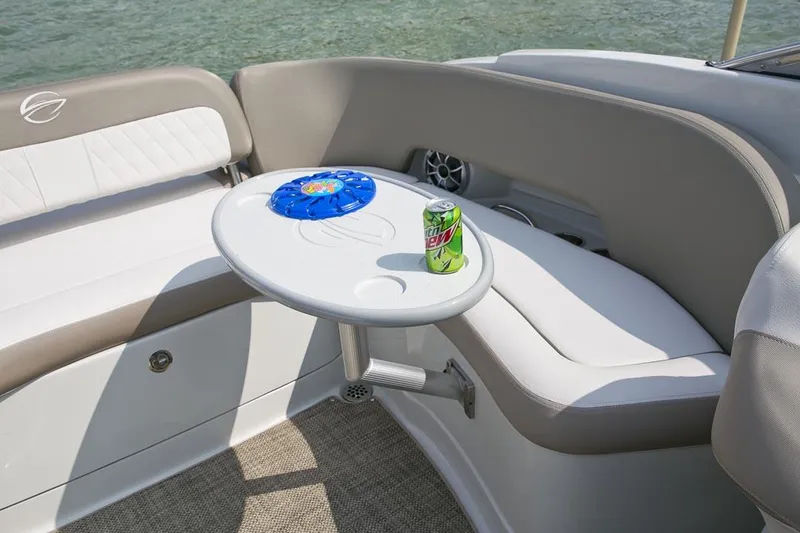 Slide: The Image of Manufacturer Provided Image: Crownline Eclipse E255 boat interior with table, drink, and seating, 2026 model. - 9
