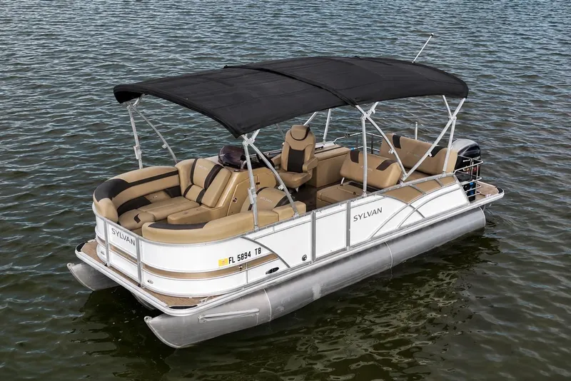 The Image of 2021 Sylvan L1 SPX pontoon boat with canopy on calm water. - 0