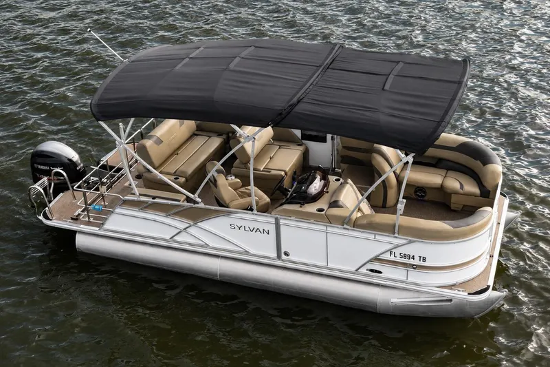 Slide: The Image of 2021 Sylvan L1 SPX pontoon boat with canopy on water. - 2
