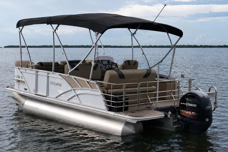 Slide: The Image of 2021 Sylvan L1 SPX pontoon boat with Yamaha outboard motor on a calm lake. - 5