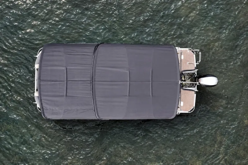 Slide: The Image of Aerial view of 2021 Sylvan L1 SPX boat with cover on water. - 6