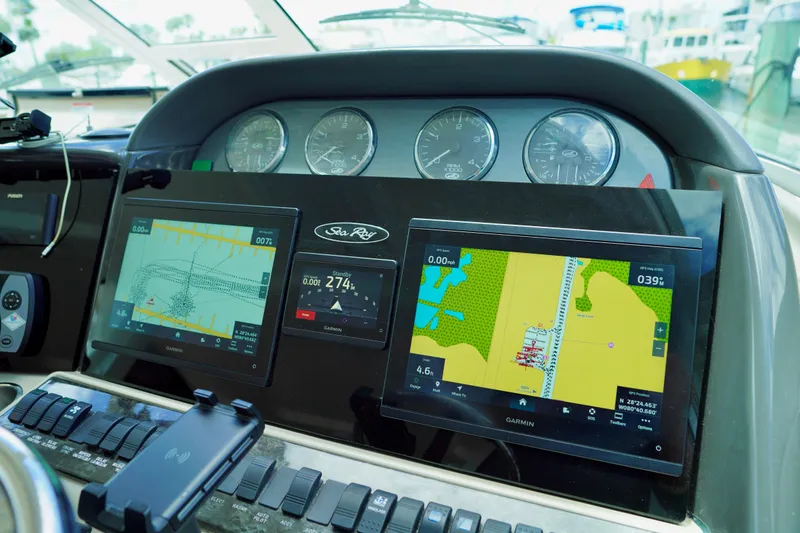 Slide: The Image of Dashboard of a 2006 Sea Ray 40 Motor Yacht with Garmin navigation displays. - 13