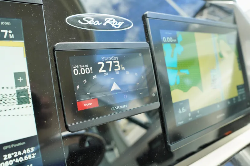 Slide: The Image of Garmin navigation system on 2006 Sea Ray 40 Motor Yacht dashboard, displaying GPS and map data. - 14