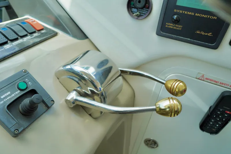 Slide: The Image of Control panel of a 2006 Sea Ray 40 Motor Yacht with throttle and bow thruster. - 17