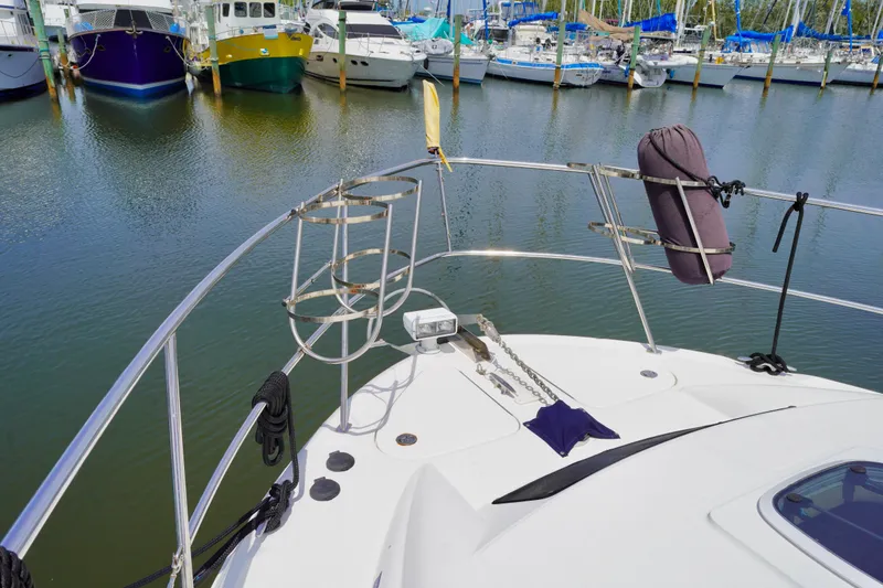 Slide: The Image of 2006 Sea Ray 40 Motor Yacht docked in marina, surrounded by other boats. - 22