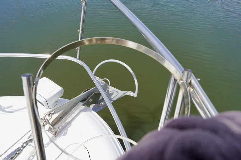 Slide: The Image of Bow view of 2006 Sea Ray 40 Motor Yacht with anchor and railing over water. - 23