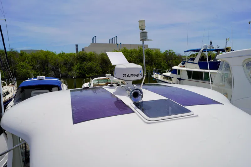 Slide: The Image of 2006 Sea Ray 40 Motor Yacht with Garmin radar, docked among other boats. - 28