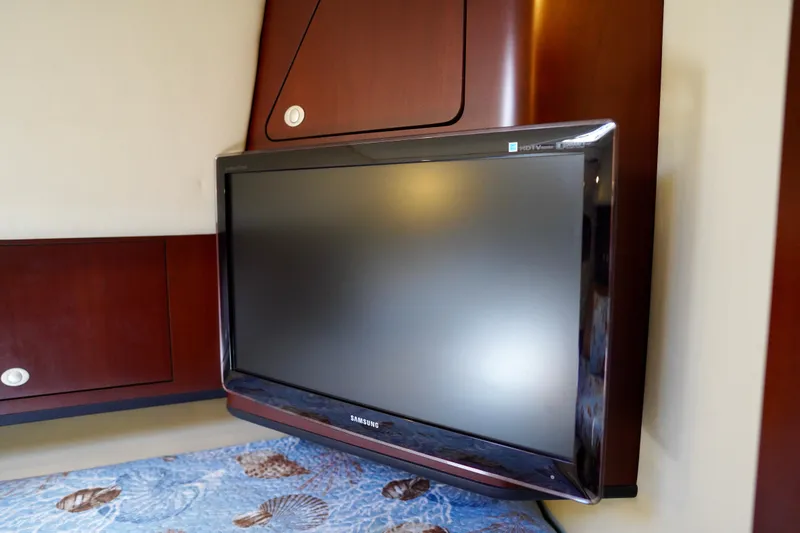 Slide: The Image of Flat-screen TV in 2006 Sea Ray 40 Motor Yacht cabin with wood paneling. - 32