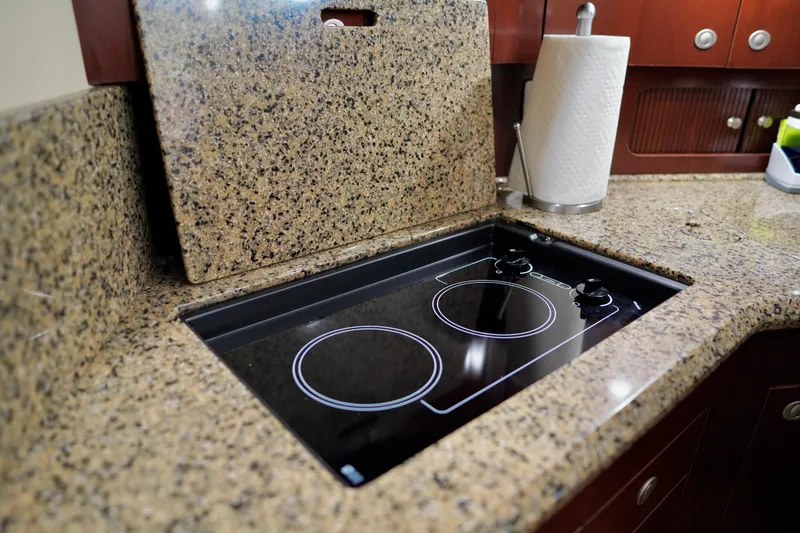 Slide: The Image of Granite countertop with electric stove in 2006 Sea Ray 40 Motor Yacht kitchen. - 41