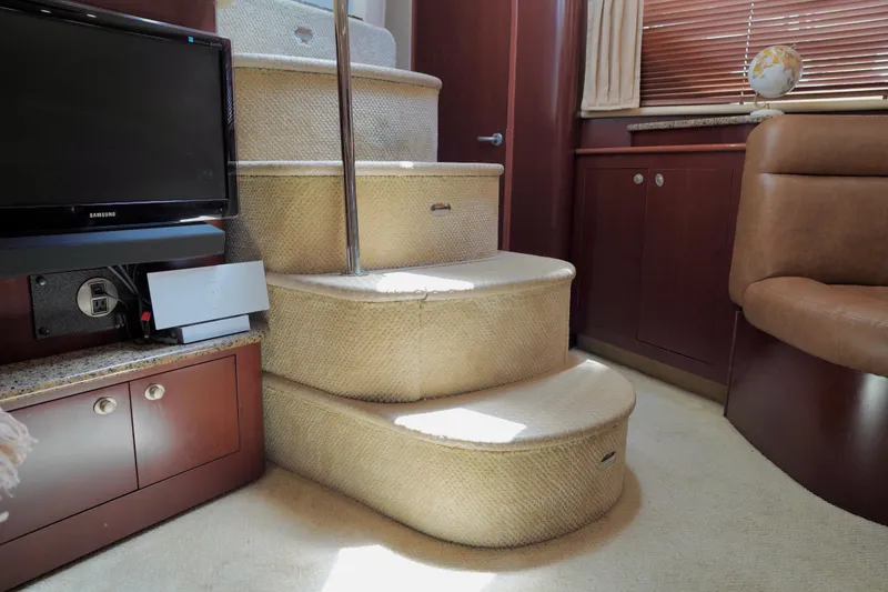 Slide: The Image of Interior of 2006 Sea Ray 40 Motor Yacht with carpeted stairs and wooden cabinetry. - 49