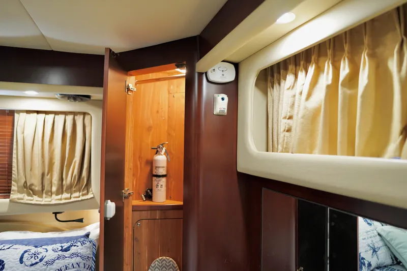 Slide: The Image of Interior of 2006 Sea Ray 40 Motor Yacht with wooden cabinetry and fire extinguisher. - 55