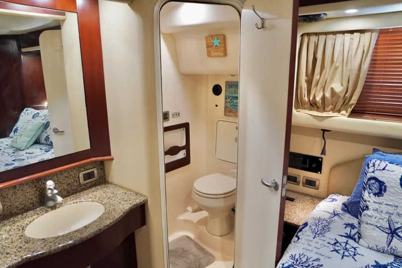 Slide: The Image of Luxurious 2006 Sea Ray 40 Motor Yacht interior with elegant bathroom and cozy bedroom. - 58