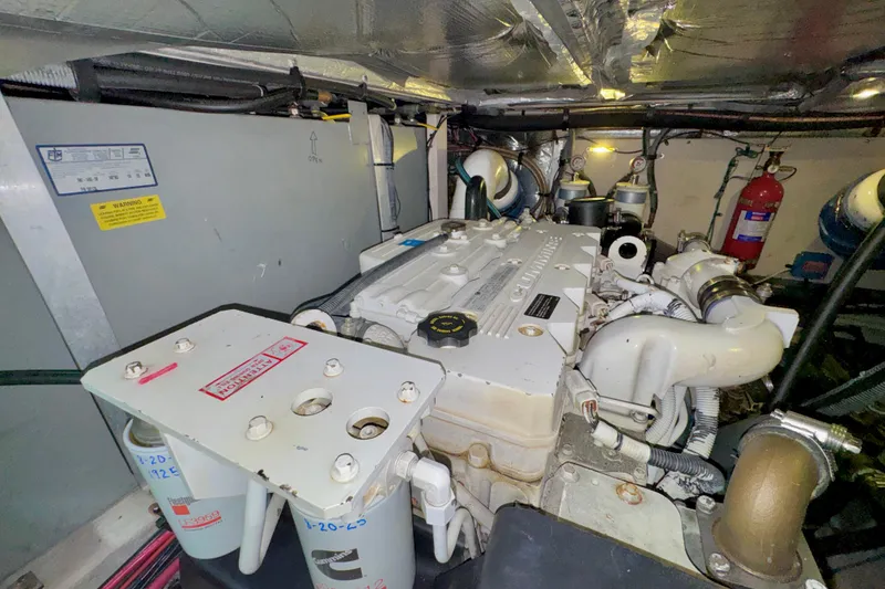 Slide: The Image of Engine room of a 2006 Sea Ray 40 Motor Yacht, featuring a Cummins engine. - 69