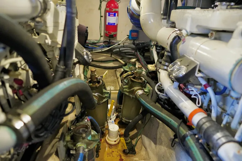 Slide: The Image of Engine room of 2006 Sea Ray 40 Motor Yacht with visible pipes and machinery. - 70