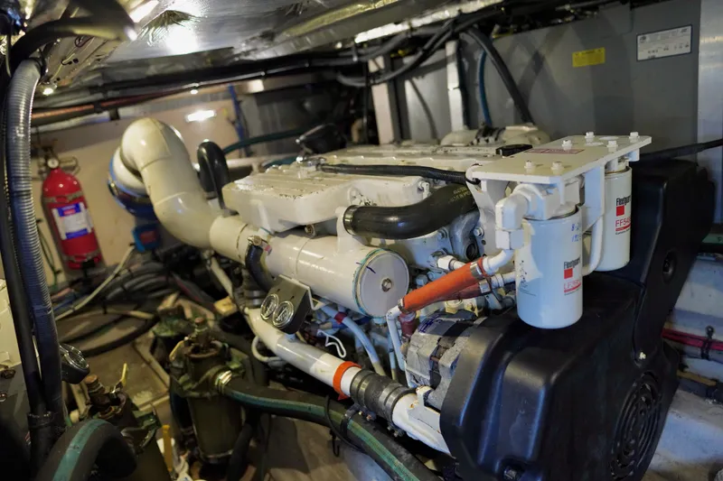 Slide: The Image of Engine room of a 2006 Sea Ray 40 Motor Yacht, showcasing detailed machinery and components. - 72