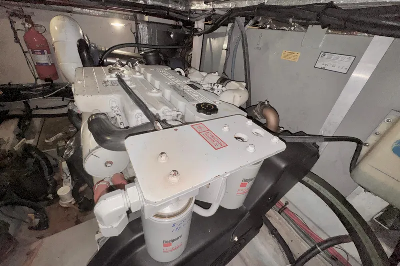Slide: The Image of Engine room of a 2006 Sea Ray 40 Motor Yacht, showcasing mechanical components. - 73