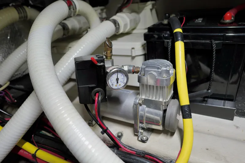 Slide: The Image of Engine room of 2006 Sea Ray 40 Motor Yacht with hoses and equipment. - 75