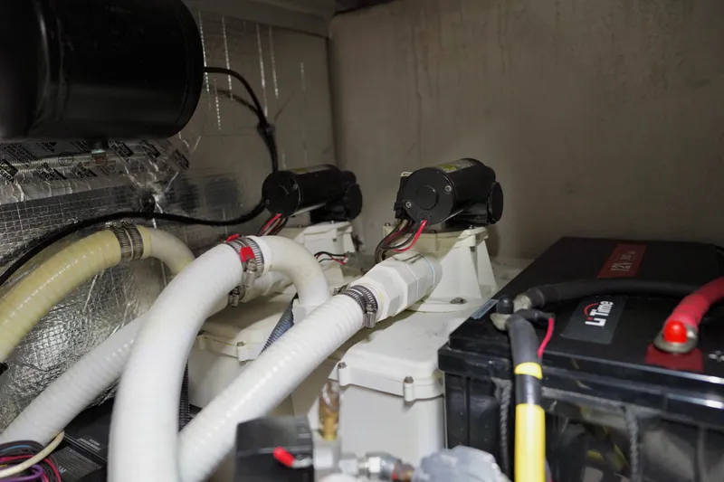 Slide: The Image of Engine room of 2006 Sea Ray 40 Motor Yacht with pumps and battery. - 76