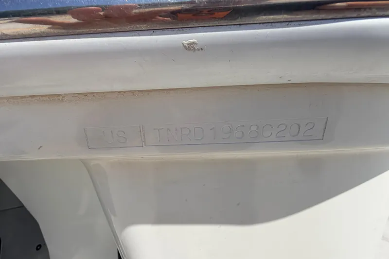 Slide: The Image of Hull identification number on a 2002 Formula 330 Sun Sport boat. - 11