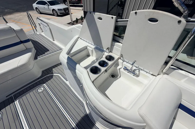 Slide: The Image of 2002 Formula 330 Sun Sport boat interior with sink and seating area. - 18