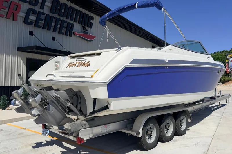 Slide: The Image of 2002 Formula 330 Sun Sport boat on trailer at boating center. - 2