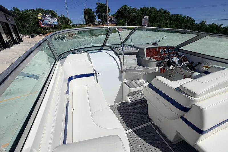 Slide: The Image of 2002 Formula 330 Sun Sport boat interior with white seating and modern dashboard. - 20