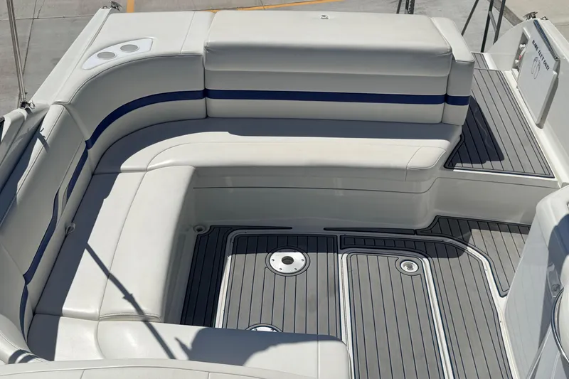 Slide: The Image of 2002 Formula 330 Sun Sport boat interior with white seating and gray flooring. - 25