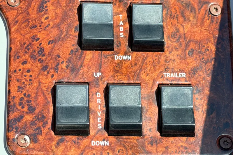 Slide: The Image of Control panel of a 2002 Formula 330 Sun Sport boat with wood grain finish. - 28