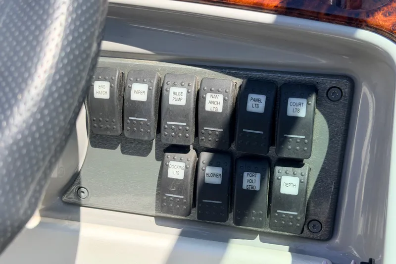 Slide: The Image of Control panel of a 2002 Formula 330 Sun Sport boat with labeled switches. - 29