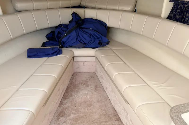 Slide: The Image of Interior of 2002 Formula 330 Sun Sport boat with beige seating and blue jacket. - 33