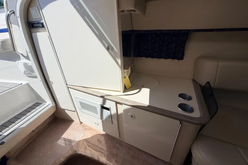 Slide: The Image of 2002 Formula 330 Sun Sport cabin interior with kitchenette and seating area. - 35