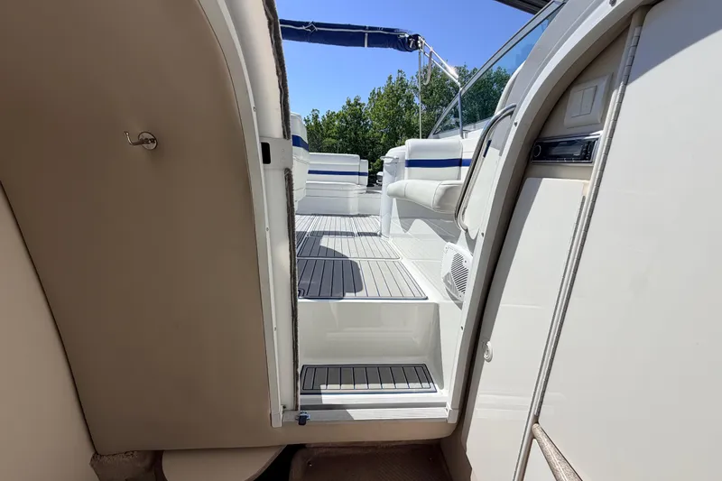 Slide: The Image of 2002 Formula 330 Sun Sport boat interior with open cabin door and seating area. - 36