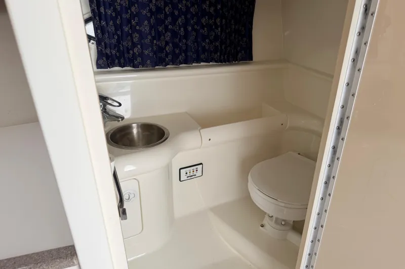 Slide: The Image of 2002 Formula 330 Sun Sport boat bathroom with sink and toilet. - 38