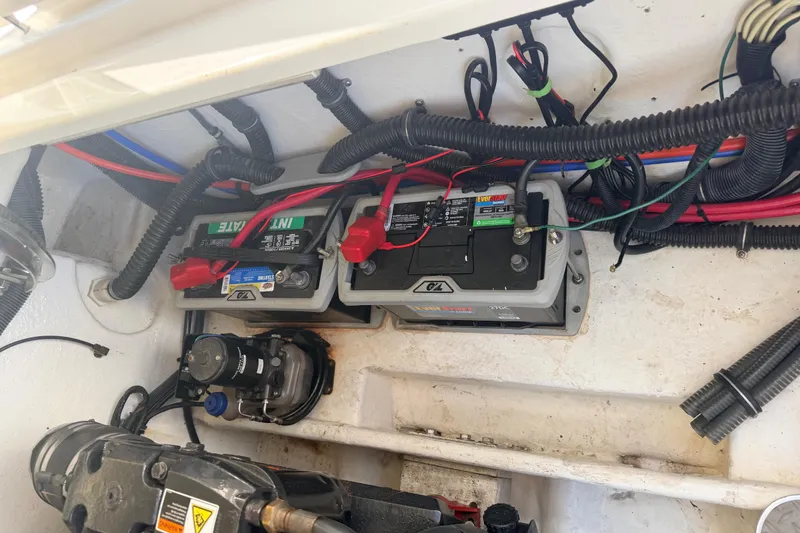 Slide: The Image of 2002 Formula 330 Sun Sport boat battery compartment with wiring and components. - 45