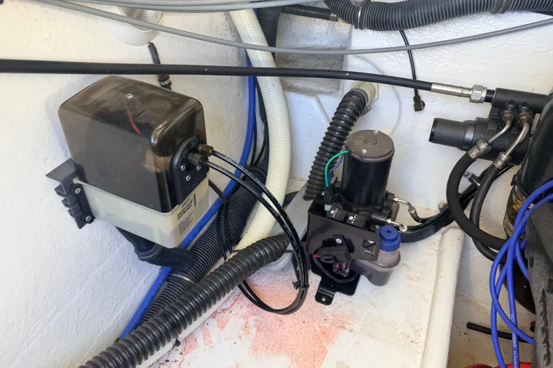 Slide: The Image of Engine compartment of a 2002 Formula 330 Sun Sport boat, showcasing wiring and components. - 48