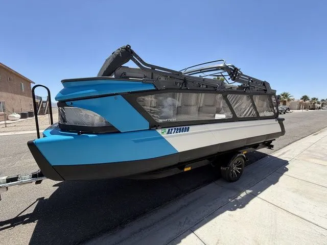 The Image of 2023 Sea-Doo Switch Cruise 21 on trailer, blue and black, side view. - 1