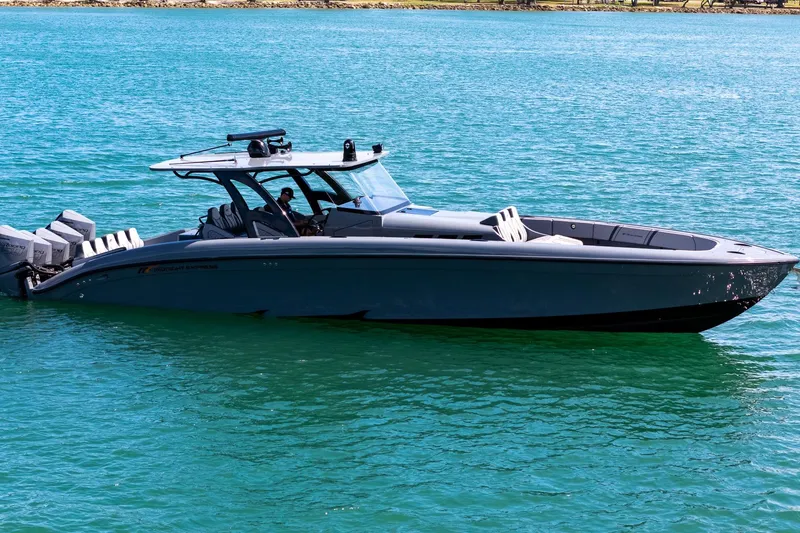 Slide: The Image of 2023 Midnight Express 43 Solstice boat on clear blue water. - 1
