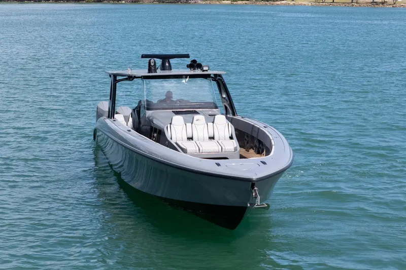 Slide: The Image of 2023 Midnight Express 43 Solstice boat on calm blue water. - 4
