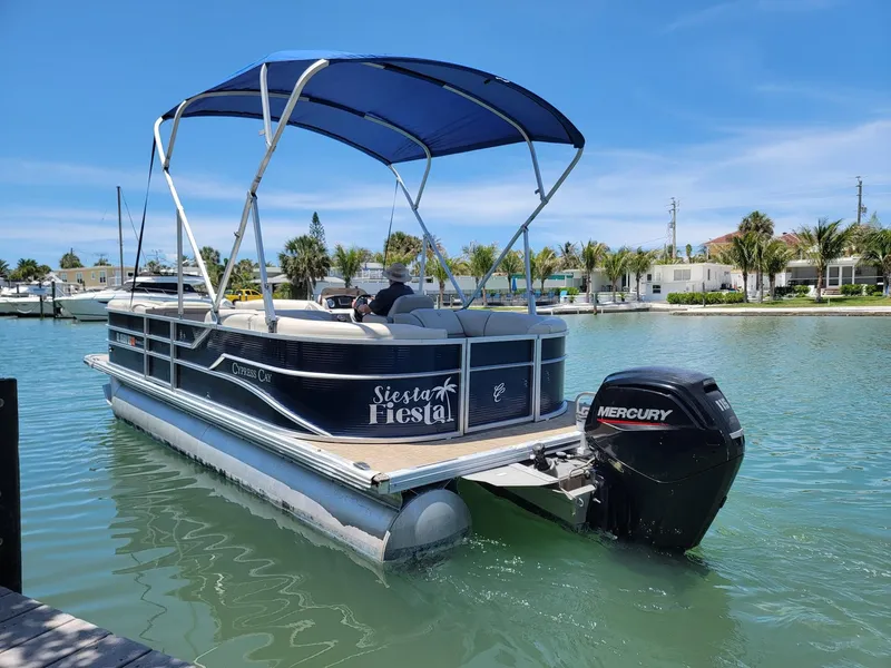 The Image of 2020 Cypress Cay 232 Seabreeze pontoon boat on calm water. - 1