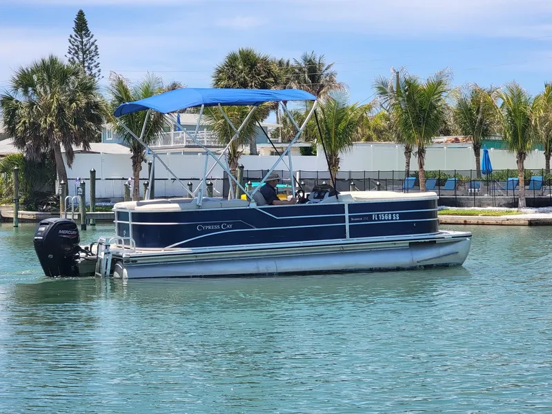 Slide: The Image of 2020 Cypress Cay 232 Seabreeze pontoon boat on calm water. - 2