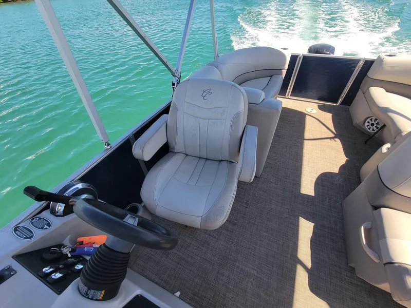 Slide: The Image of Interior of a 2020 Cypress Cay 232 Seabreeze pontoon boat on the water. - 6