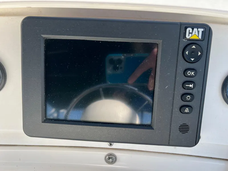 Slide: The Image of Control panel on a 2003 Silverton 43 Motor Yacht dashboard. - 11
